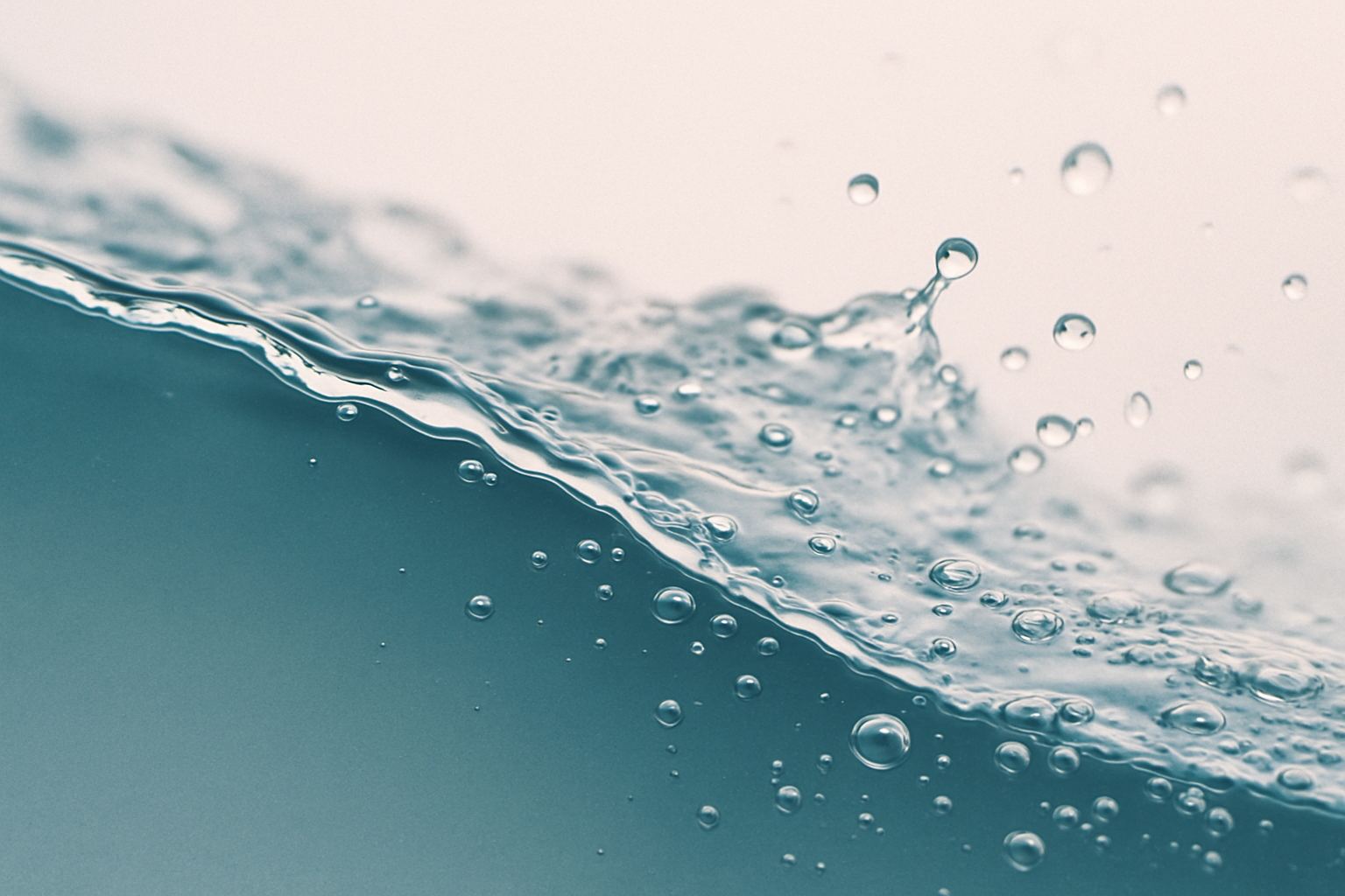 Clear water breaking across cold glass